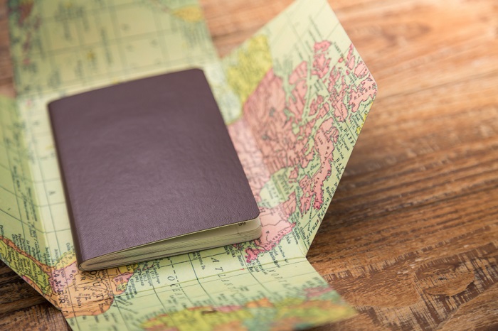 Passport on top of a map